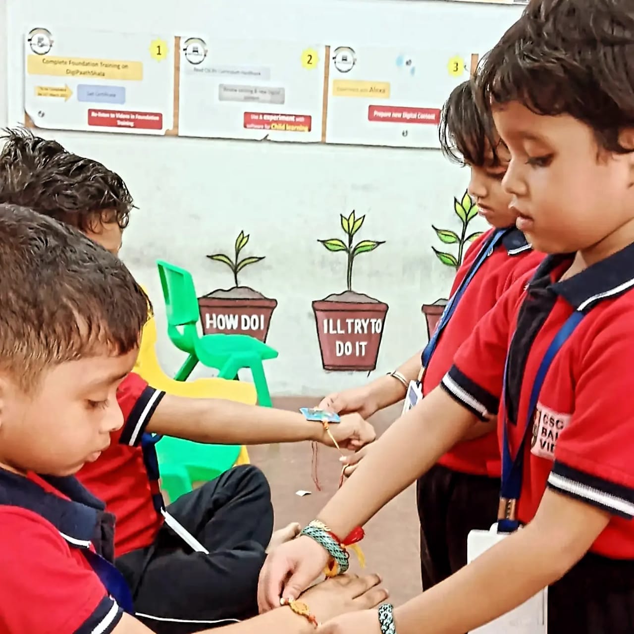 Children tying rakhis on each other’s wrists in a Bal Vidyalaya classroom