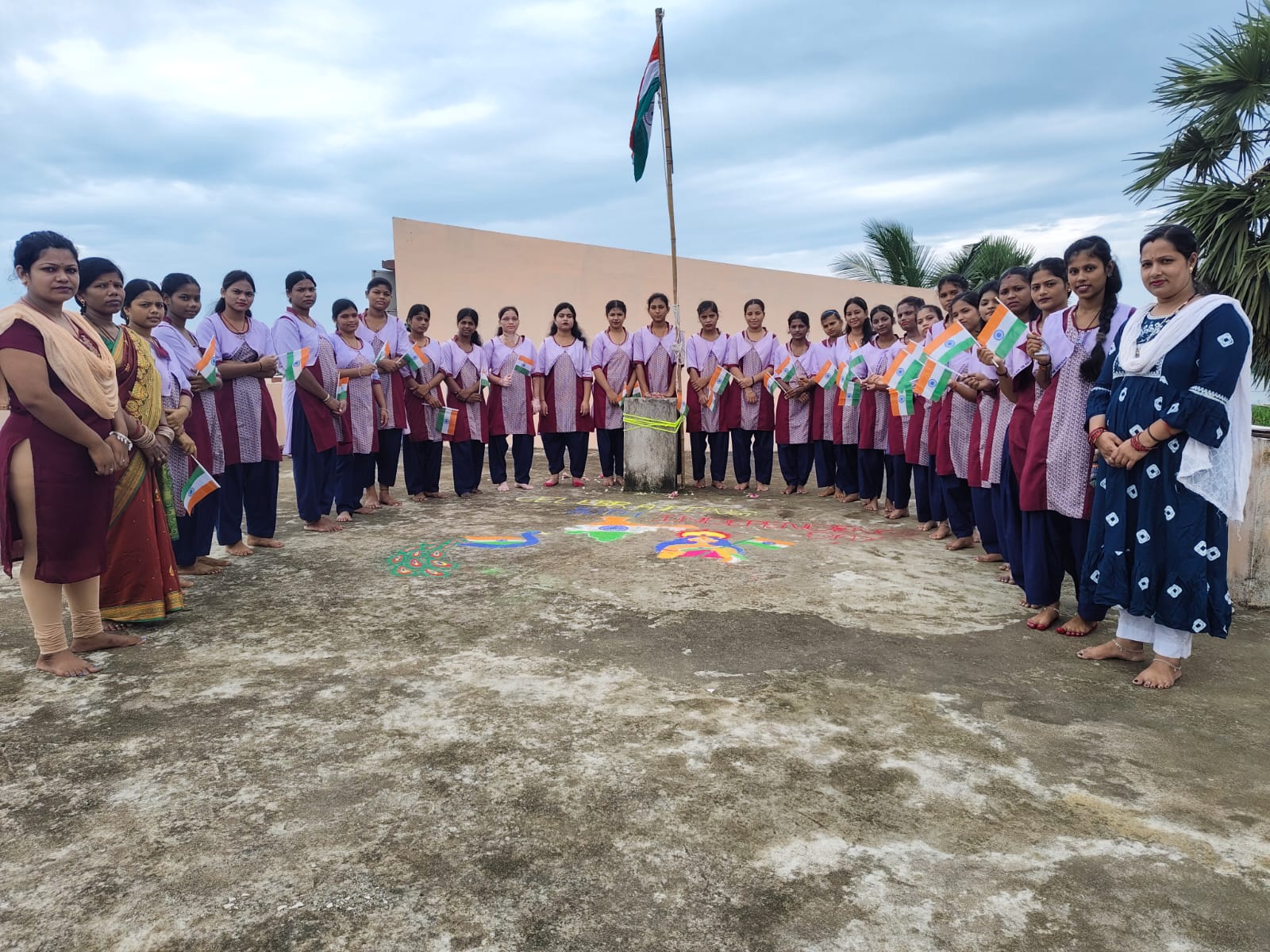 Independence Day flag hoisting with rangoli on the terrace