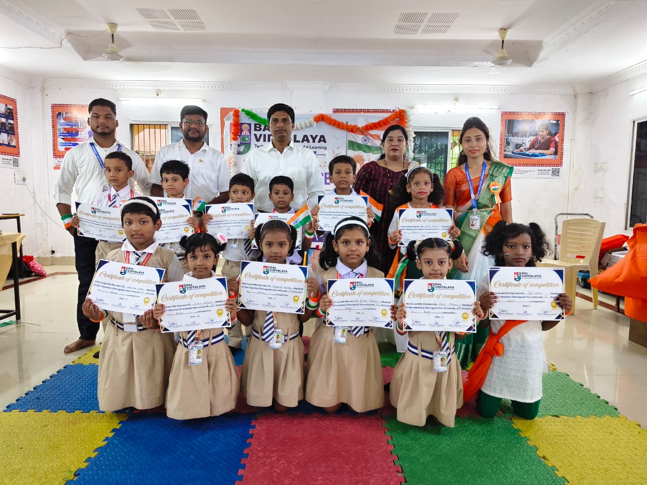 Bal Vidyalaya students and teachers with certificates of competition